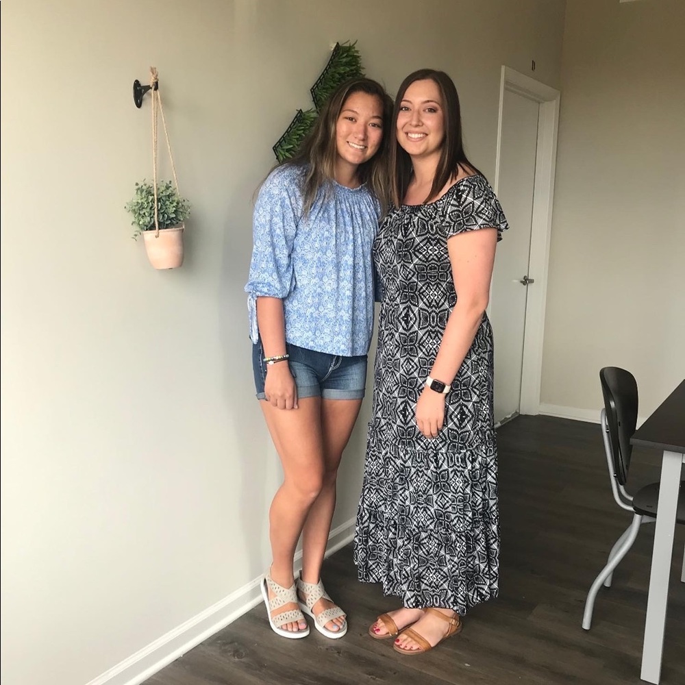 (On the left) long sleeve blue top size medium
